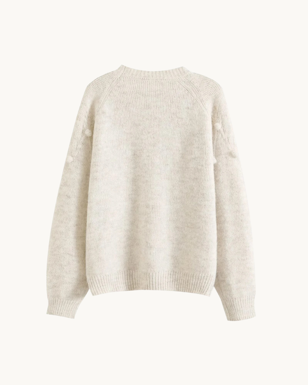 ELEGANTE SWEATER MET POMPONS